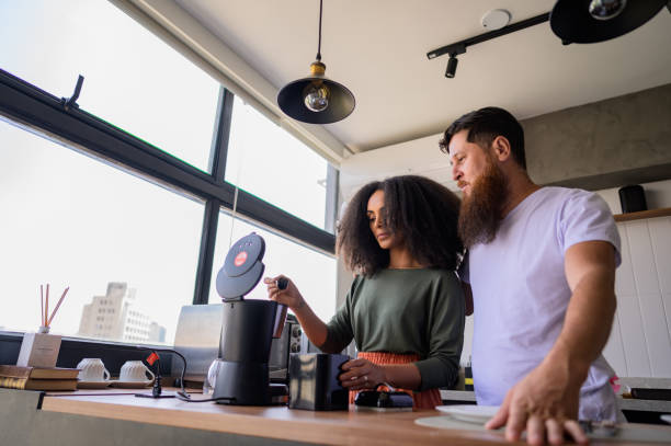 istock Couple preparing coffee and sandwiches together 1441432568
