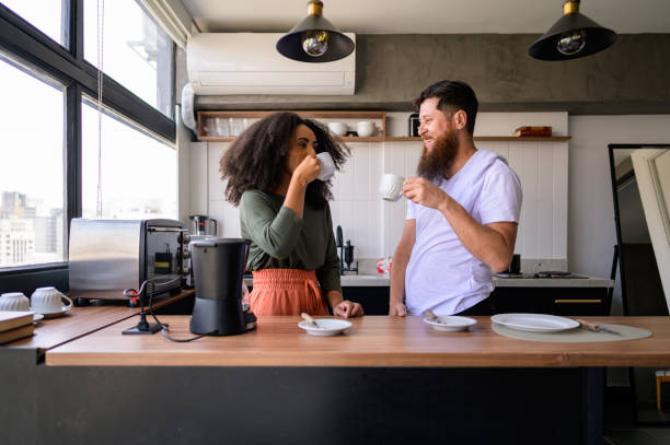 istock Couple drinking coffee in the kitchen 1441432615