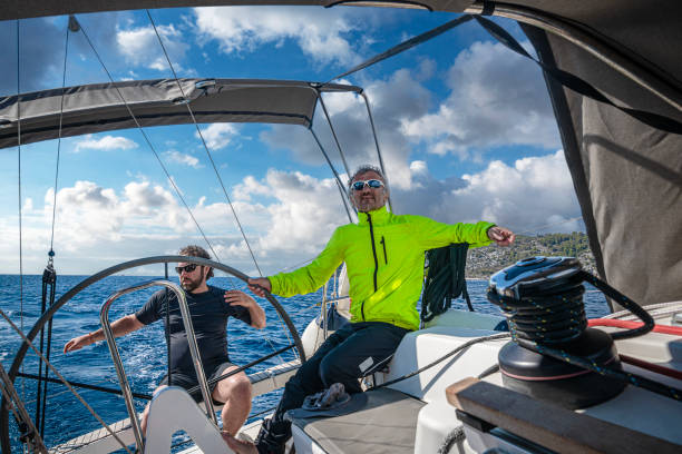 istock Two adults using a sailboat in the Aegean Sea. 1441432616