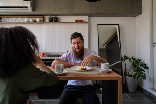 istock Couple drinking coffee in the kitchen 1441432624