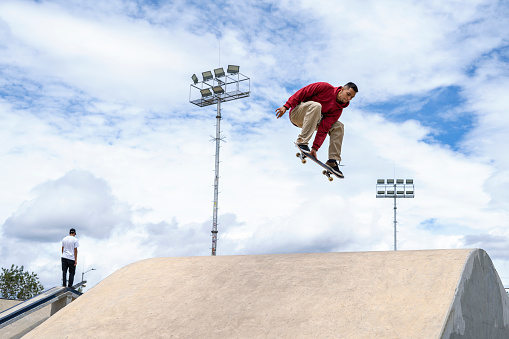 Happy young skateboarders having fun in a skatepark. Concept of skateboarders.