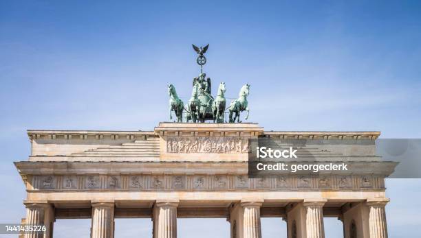 Horse And Chariot Statue On Top Of Brandenburg Gate Stock Photo - Download Image Now
