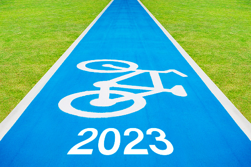 The new year 2023 and Bicycle Traffic  Sign written on a bicycle track.