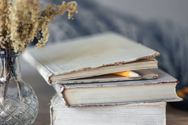 istock Cozy home composition with books on the table close-up. 1441437585