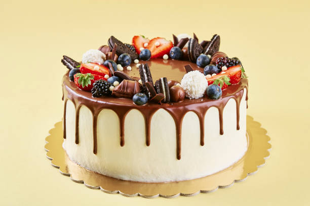 istock Cake decorated with strawberry and chocolate on yellow background 1441438859