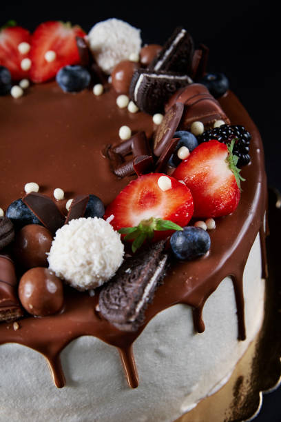 istock Cake decorated with strawberry and chocolate on dark background 1441438877