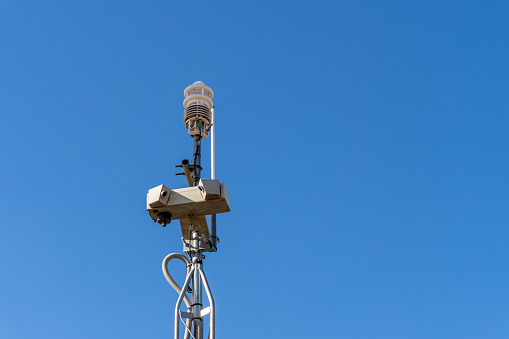 Small meteorological station in the outskirts, on a sunny day and blue sky