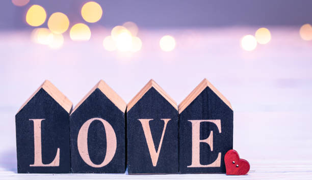istock Decorative word love on a blurred background with bokeh lights. 1441439654