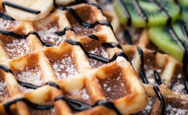istock Close-up, Belgian waffles with fruits, covered with chocolate. 1441444395