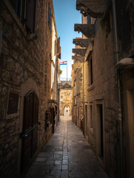 istock Narrow steet with flag in Korcula, Croatia 1441445927