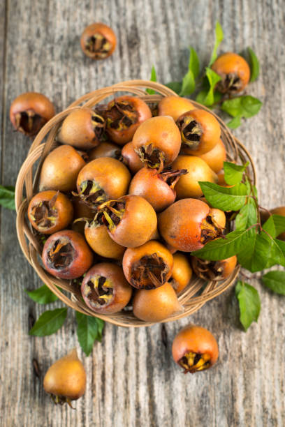 istock Fresh organic medlar on the wooden table 1441446040