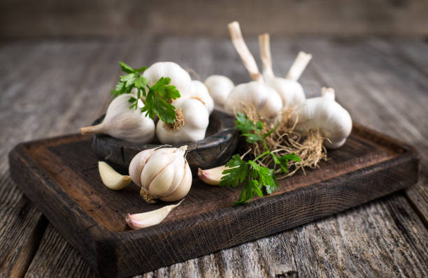 Fresh organic garlic on the wooden table stock photo