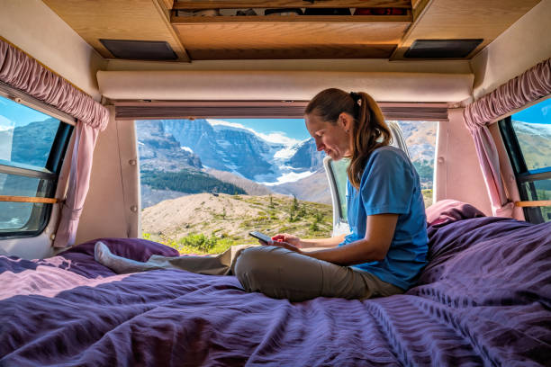 istock Woman uses Tablet RV Motor Home Reads 1441450620