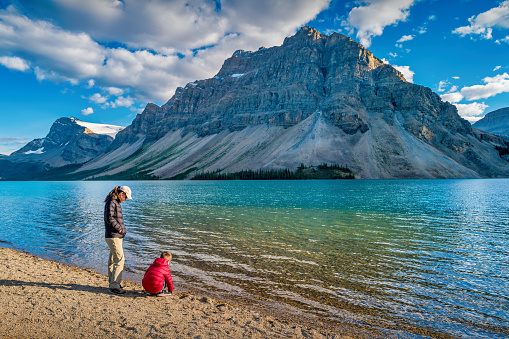 Mother and Son explores Bow Lake in the Canadian Rockies, Alberta, Canada.