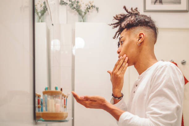 istock At home - young man brushing his teeth 1441453108