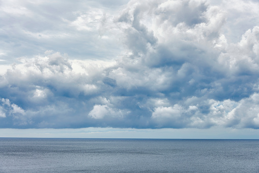 Dark clouds over a calm sea
