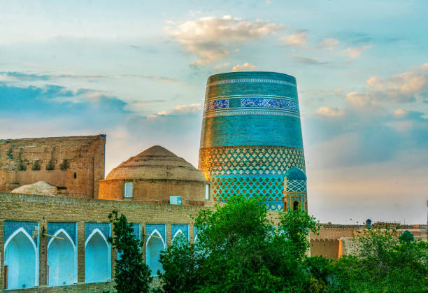 Gorgeous Minaret Kalta Minor witj blue-green tiles  tower in Khiva Gorgeous Minaret Kalta Minor witj blue-green tiles  tower in Khiva  c was built in 19 century and planned  tobe higher but  Amin Khan was killed during war chromis stock pictures, royalty-free photos & images