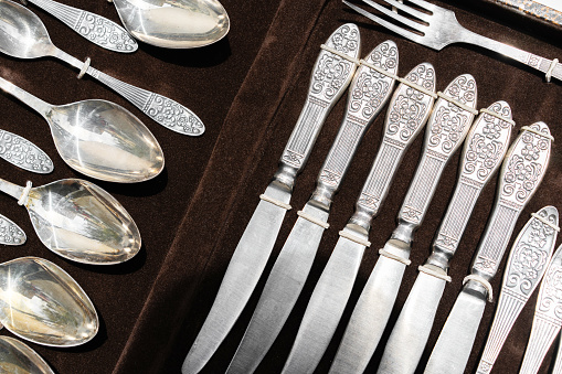 Vintage cutlery in a box. Spoons, forks and knives.