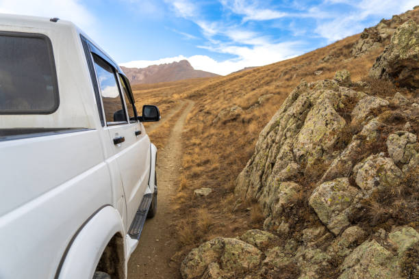 istock SUV stands in a mountainous area 1441454981