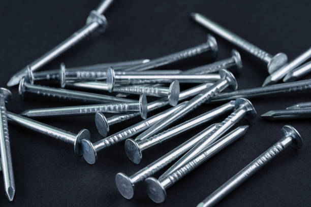 Metal nails on a black background