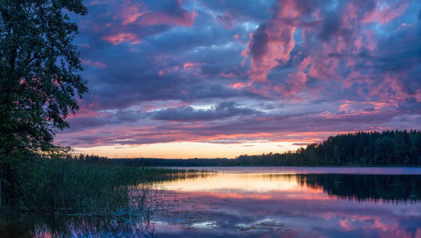 istock Purplish blue clouds over the lake 1441457483