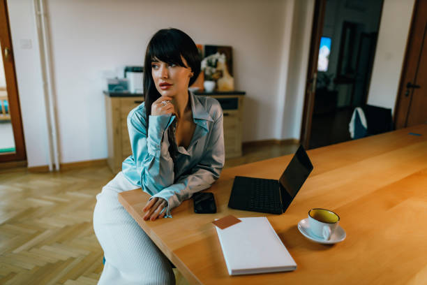 istock Young businesswoman using a laptop in the office 1441457492