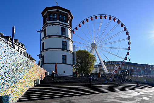 Duesseldorf, Germany, November 13, 2022 - Schlossturm with Ferris wheel \