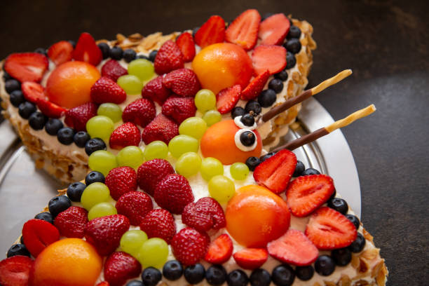 istock Birthday cake with fresh fruits 1441460010