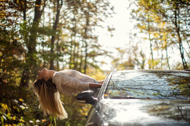 istock Young woman enjoying road trip 1441461270