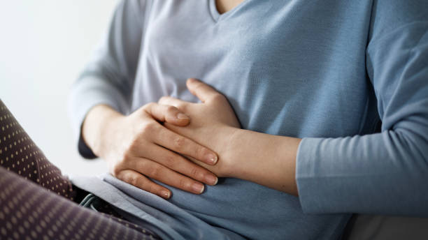 istock Woman suffering from stomach ache 1441462537