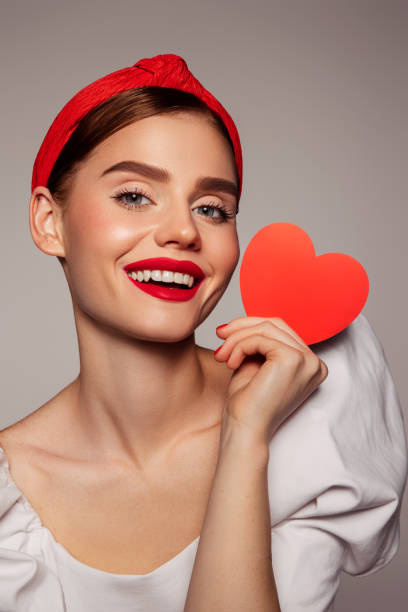 istock Beautiful emotional woman holding present box 1441463315