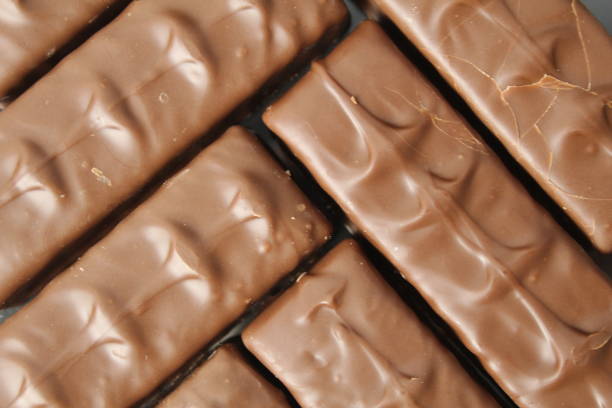 Background food from chocolate candy bars day chocolate sweets day without dieting. Delicious background.