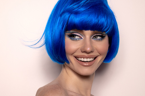 Beautiful woman with blue short hair