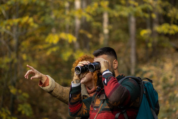 istock Portrait of a couple of hikers using binoculars 1441465647