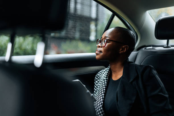 istock Businesswoman in car using smartpone. 1441466907