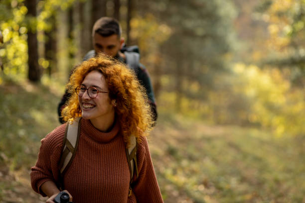 istock Happy couple walking through the woods 1441467165