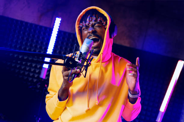 istock Young African performer recording his new track in recording studio 1441472574