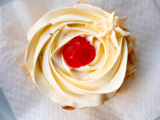 istock Sponge cake with vanilla frosting and almonds 1441475922