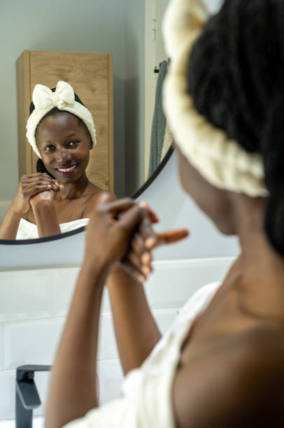 istock woman using cosmetic product 1441476478