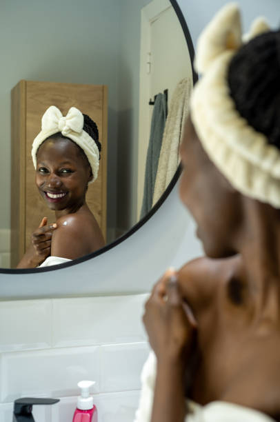 istock woman using cosmetic product 1441476505