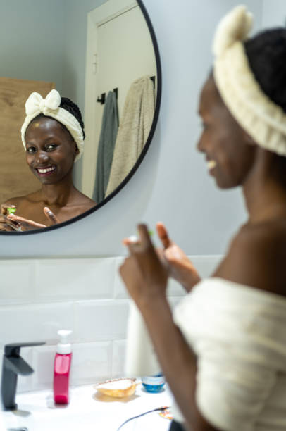 istock woman using cosmetic product 1441476514