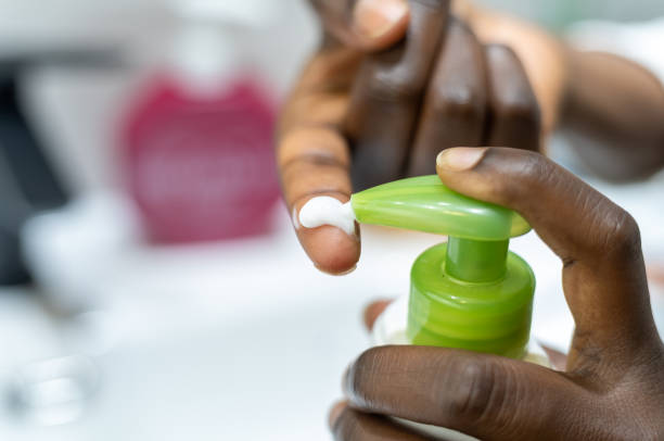 istock woman using cosmetic product 1441476552