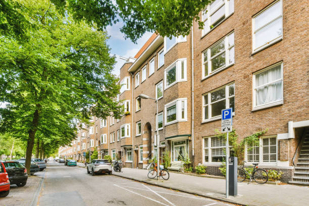 istock The city street with a multistorey brick residential building 1441478708