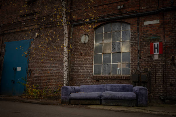 istock Old sofa in front of a historic warehouse 1441481565