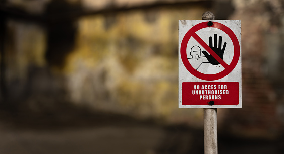 sign prohibiting entry of an unauthorized person in the old warehouse