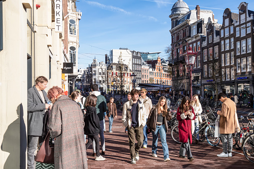 Amsterdam, Netherlands, November 13, 2022; Tourists walk through the busy center of the capital Amsterdam.