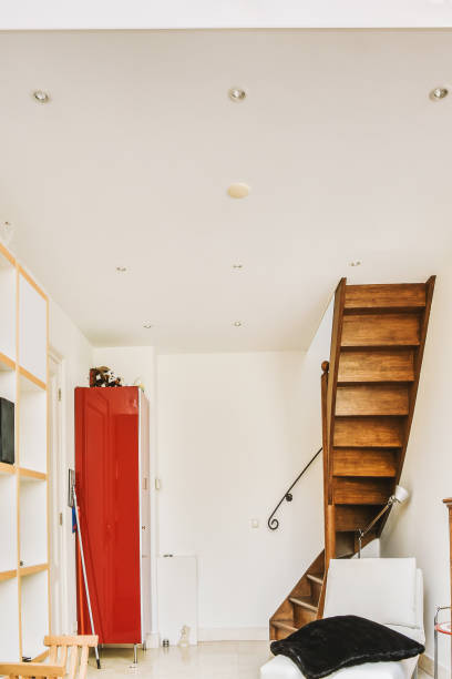 istock Wooden spiral staircase in a modern house 1441486414