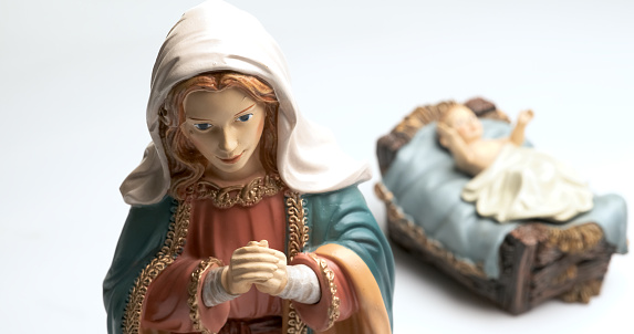 Old figurines of Virgin Mary and Baby Jesus, (focus is un Virgin Mary)