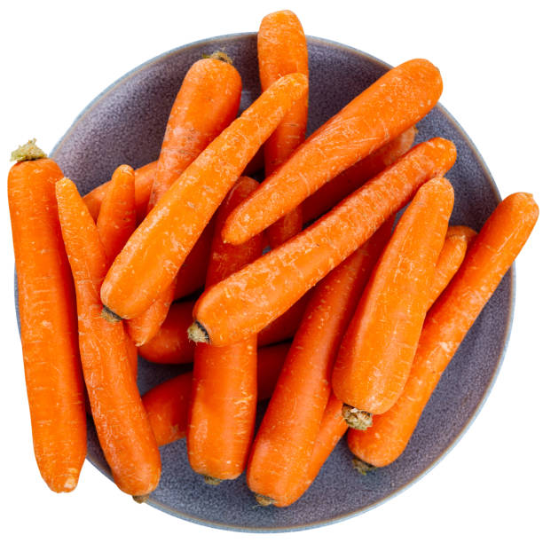 istock Plate of fresh carrots on white 1441489414