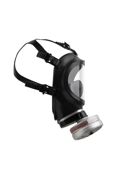 Modern black gas mask with a large transparent plastic visor. Protection against poisonous substances in the air. Isolate on a white background.